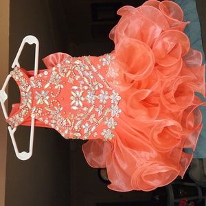 Custom Glitz toddler pageant dress. Hot coral color with Swarovski crystals.